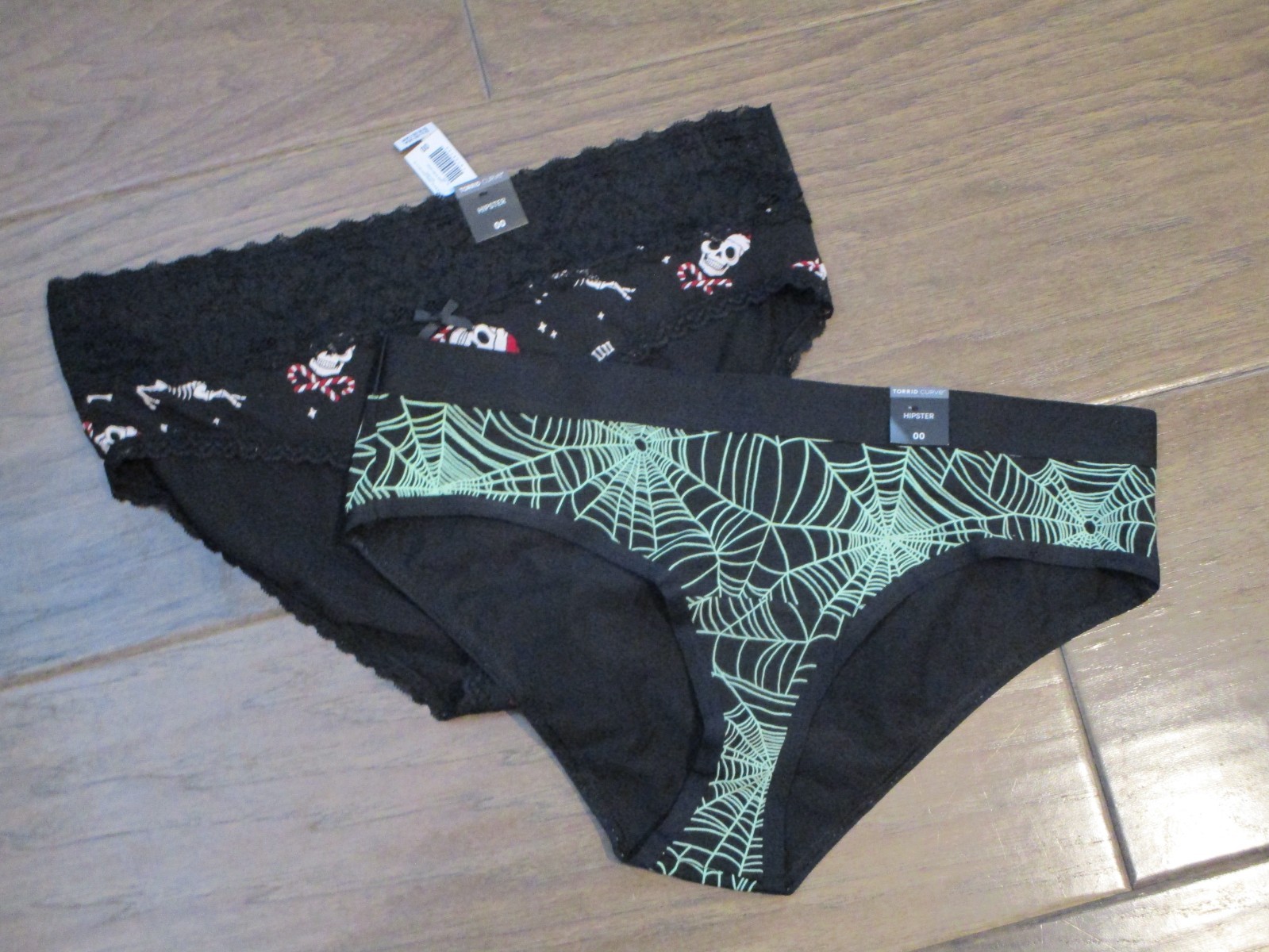 2 PAIRS TORRID HIPSTER PANTIES IN BLACK SKELETON/SPIDERWEB SIZE 00 (MED/10)