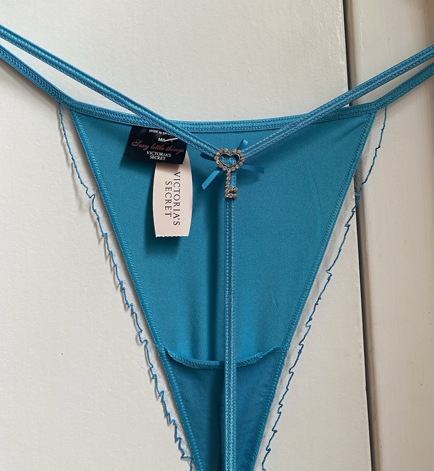 Victoria’s Secret turquoise Thong, Size S, With Rhinestone Key Design