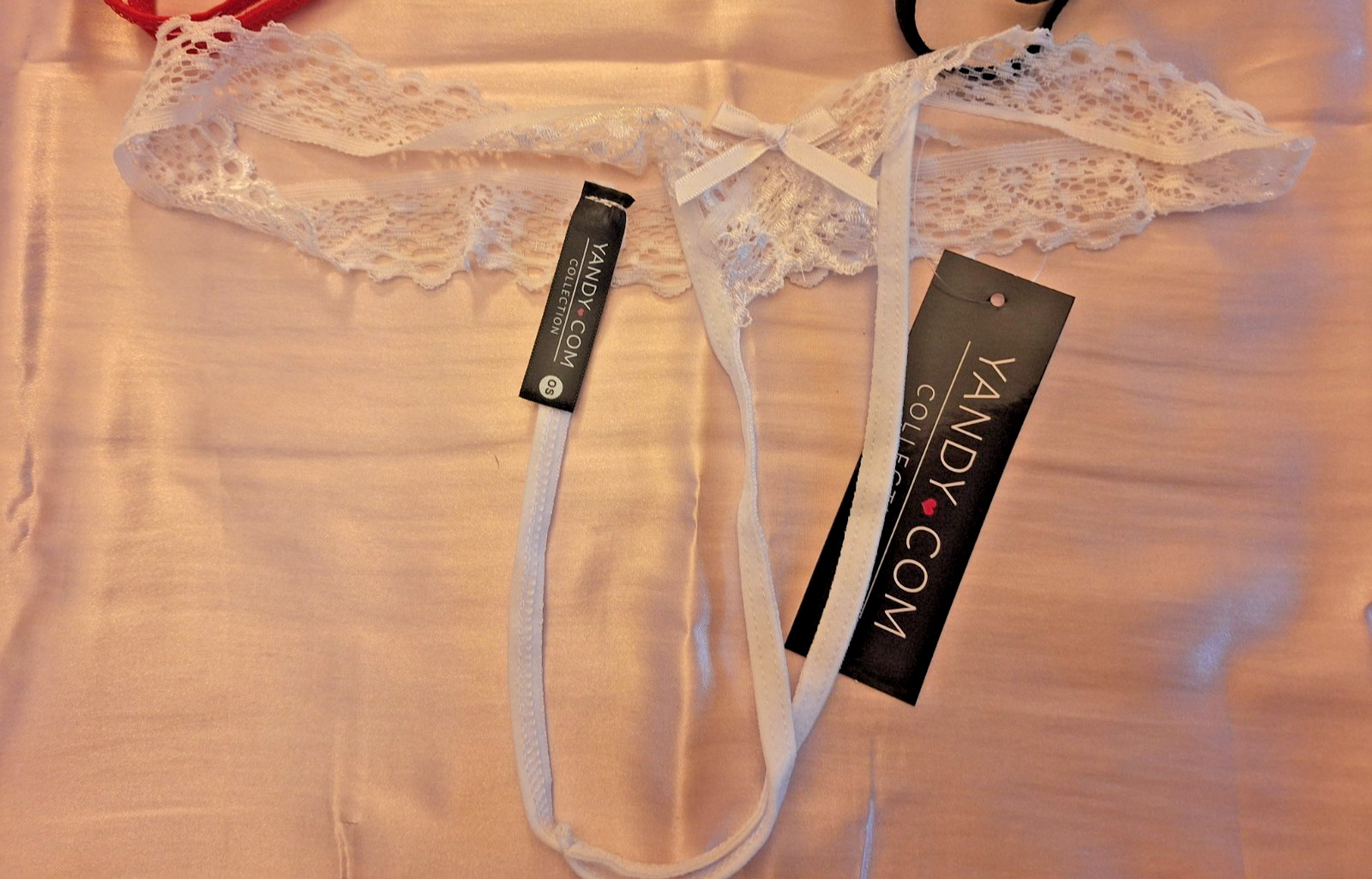 Yandy crotchless lace thongs in red, black, white (One size) Lot of (3)