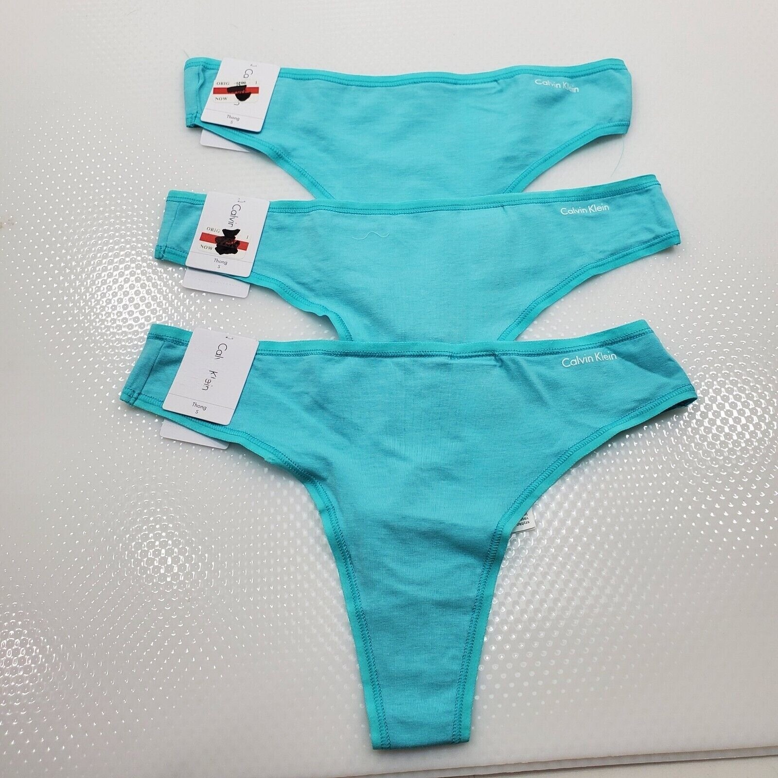 Calvin Klein 3 pack Women’s Form Thong Ripple color light blue Size small-$45