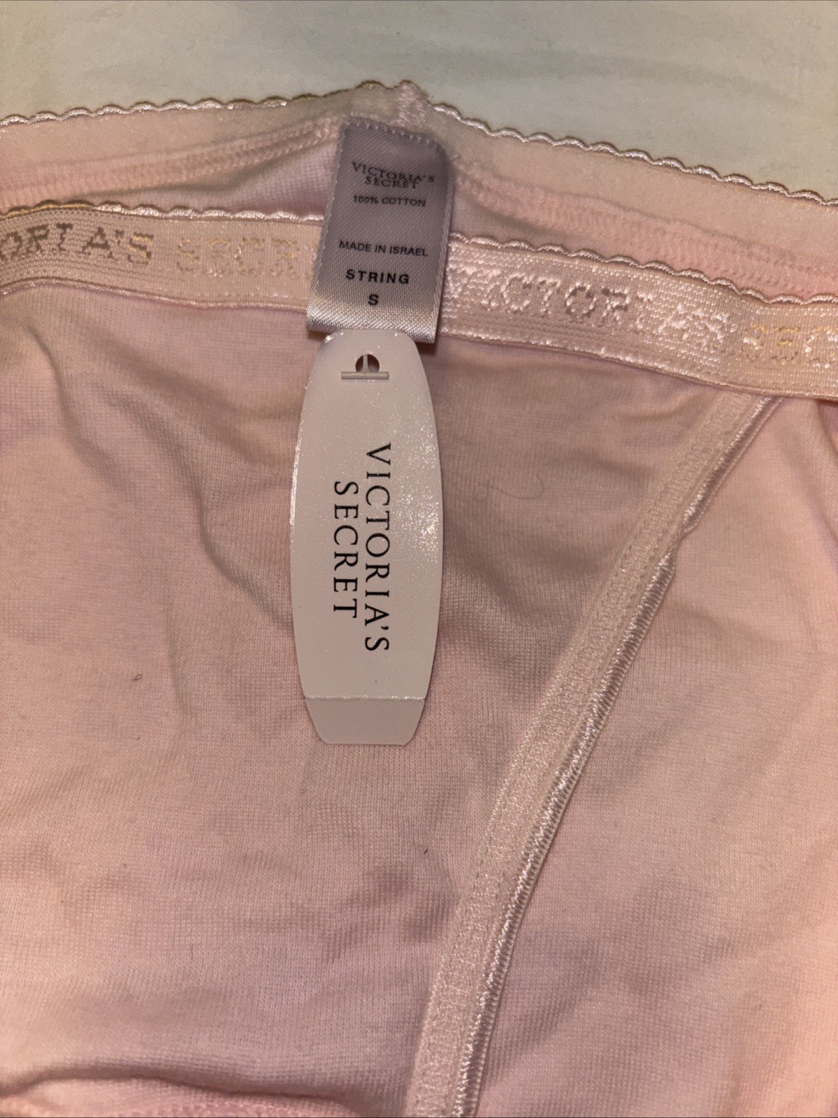 Victoria’s Secret String Bikini Panties. New with Tags Size Small .pink Logo