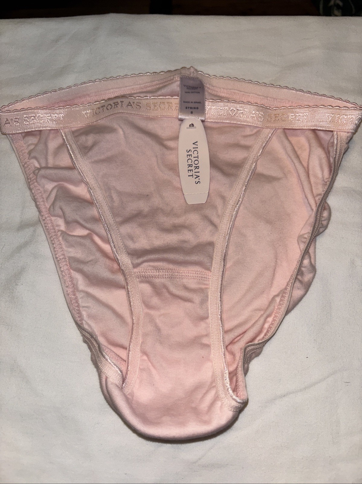 Victoria’s Secret String Bikini Panties. New with Tags Size Small .pink Logo