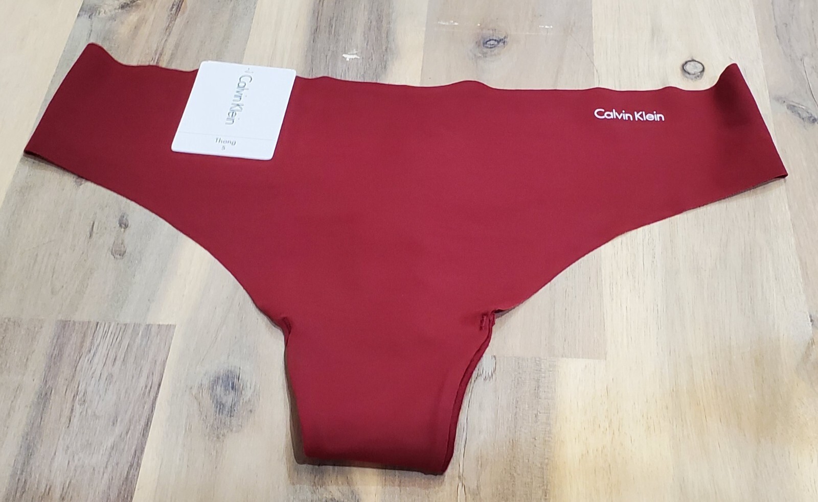 Calvin Klein Invisibles No Show Laser Cut Thong D3428 in Raspberry Jam Sze Small