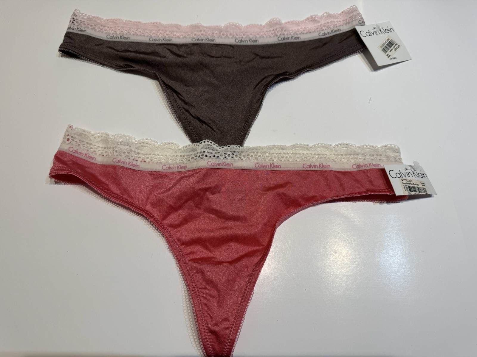NWT 2 Pairs Calvin Klein Thong Panties Size Medium Style D3377 Multicolor