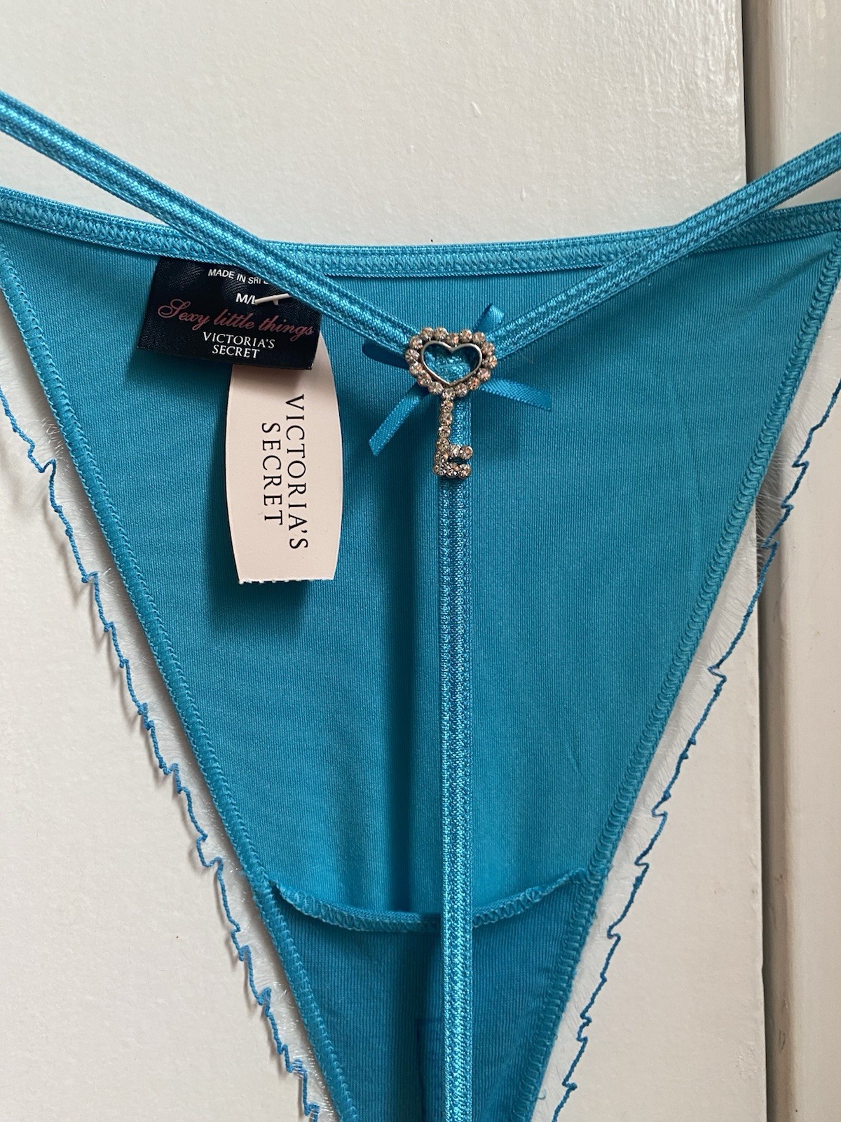 Victoria’s Secret turquoise Thong, Size S, With Rhinestone Key Design