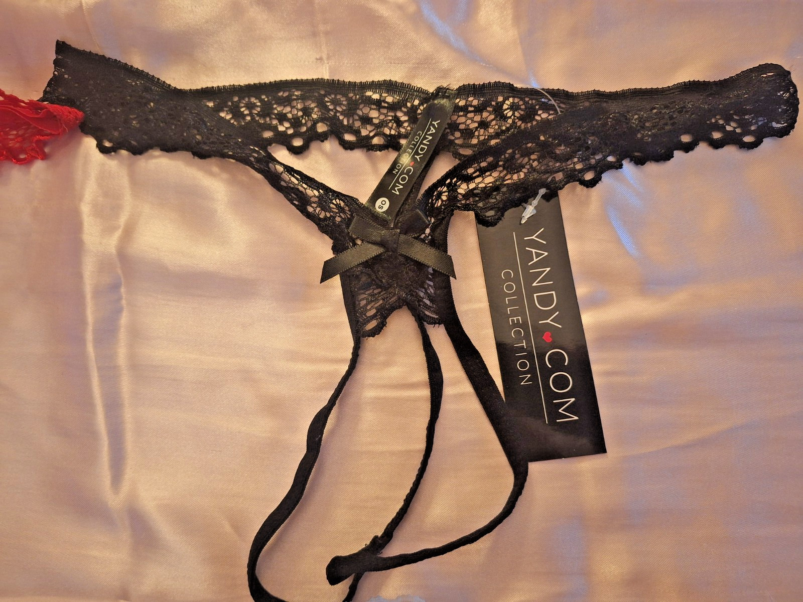 Yandy crotchless lace thongs in red, black, white (One size) Lot of (3)