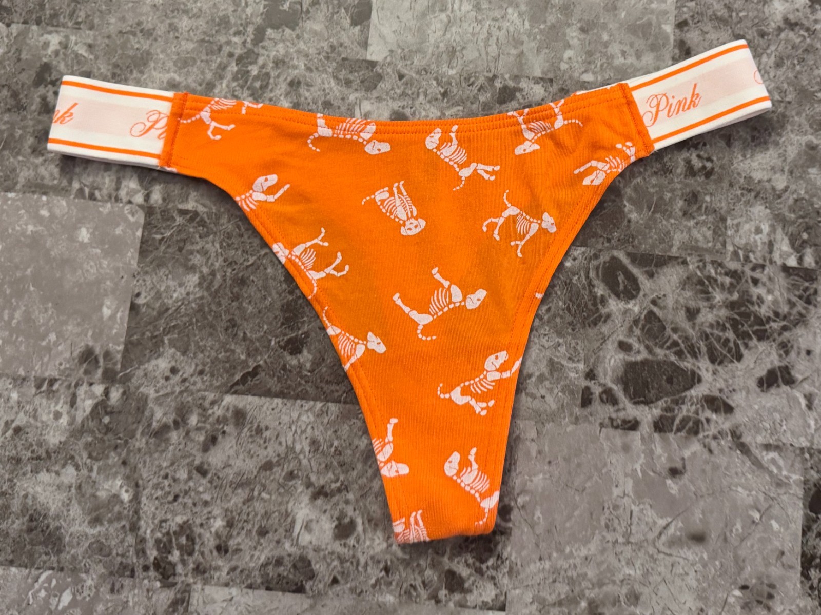 NWT VICTORIA’S SECRET PINK ORANGE WHITE SKELETON DOG HALLOWEEN THONG PANTIES
