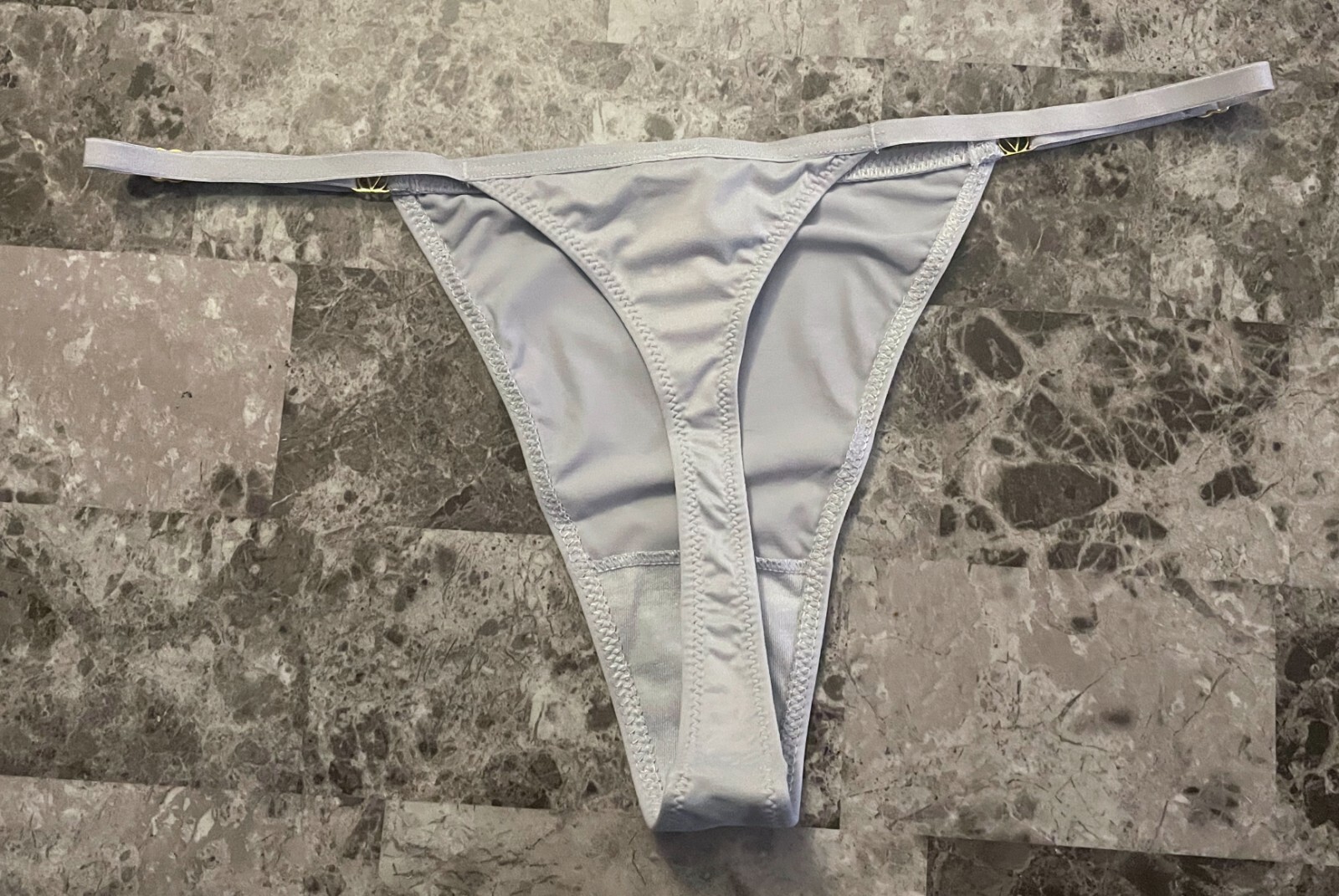 NWT VICTORIA’S SECRET LIGHT GRAY SMOOTH SOFT GOLD ADJUSTABLE STRAP THONG PANTIES