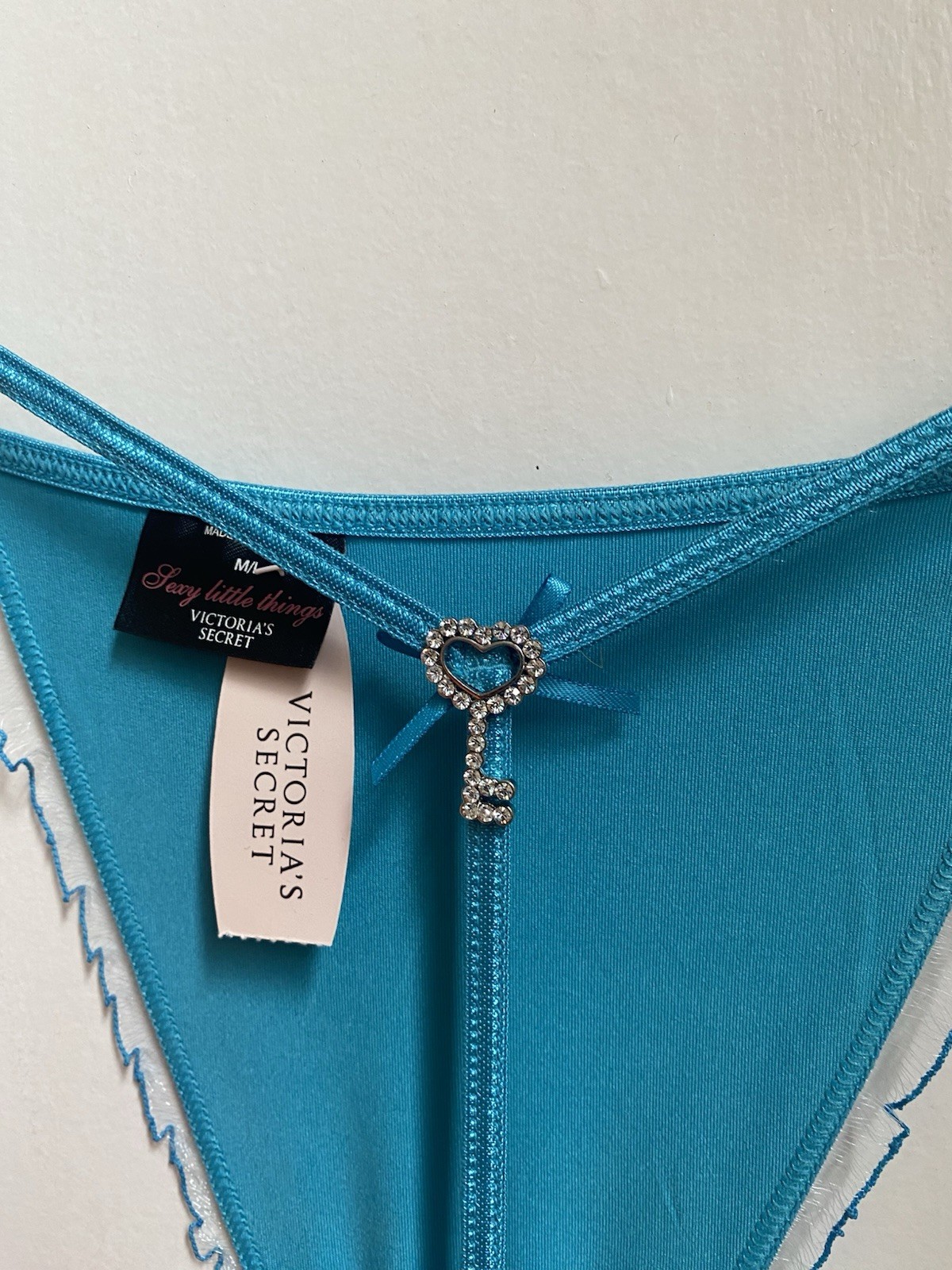 Victoria’s Secret turquoise Thong, Size S, With Rhinestone Key Design